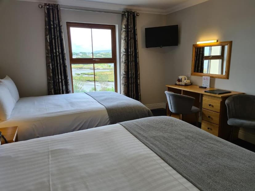 Twin hotel room with view of marshland and distant hills from Caisleain Oir Hotel