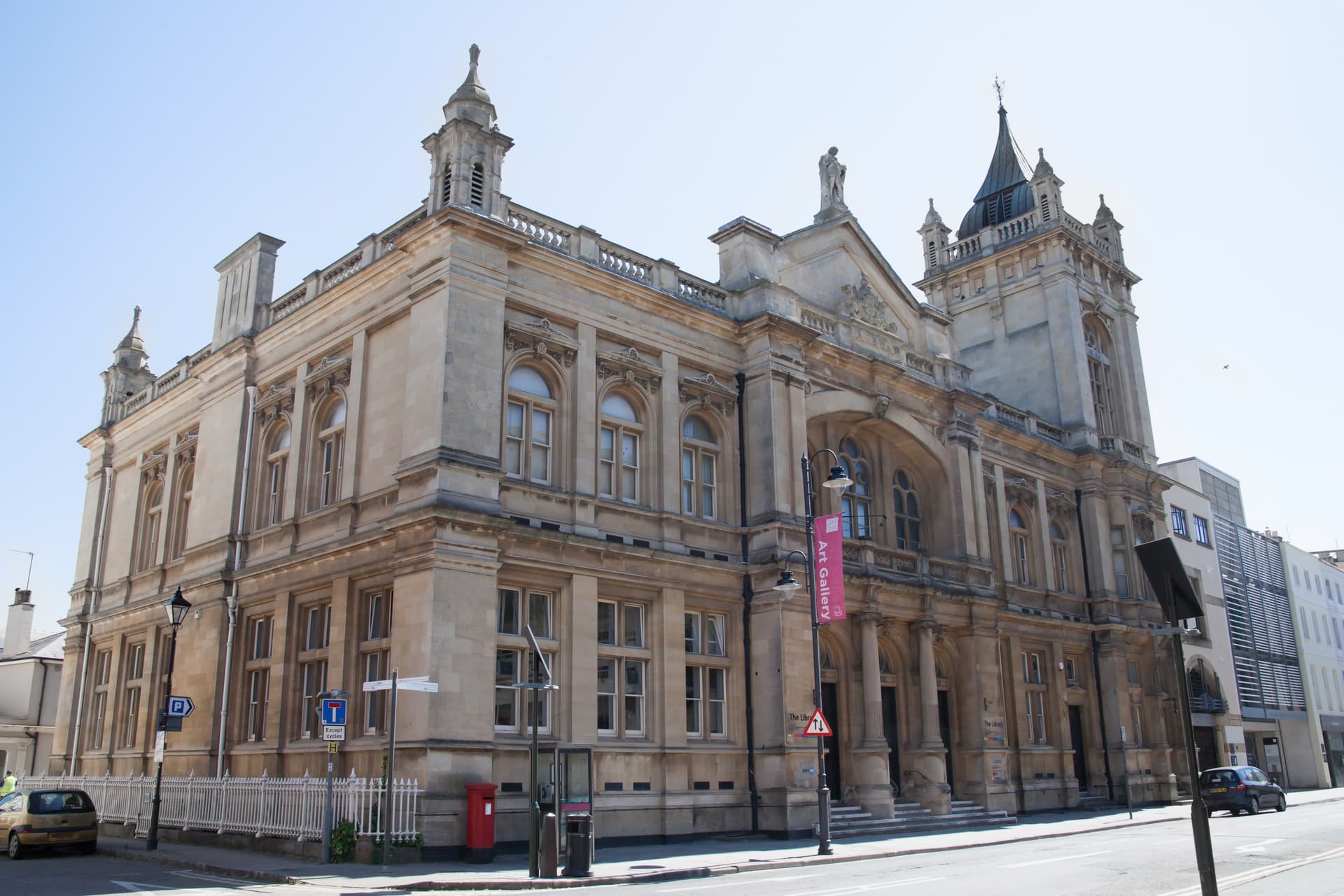 Stone building housing the Wilson Art Gallery on a sunny day in a city street.