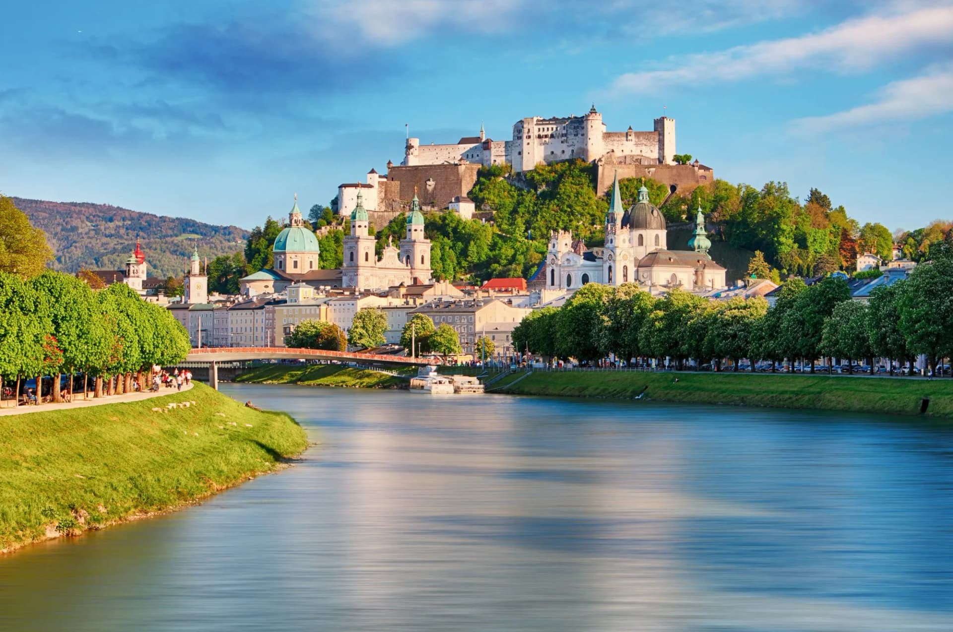 Hohensalzburg Fortress overlooking Salzburg city and the Salzach River in spring.