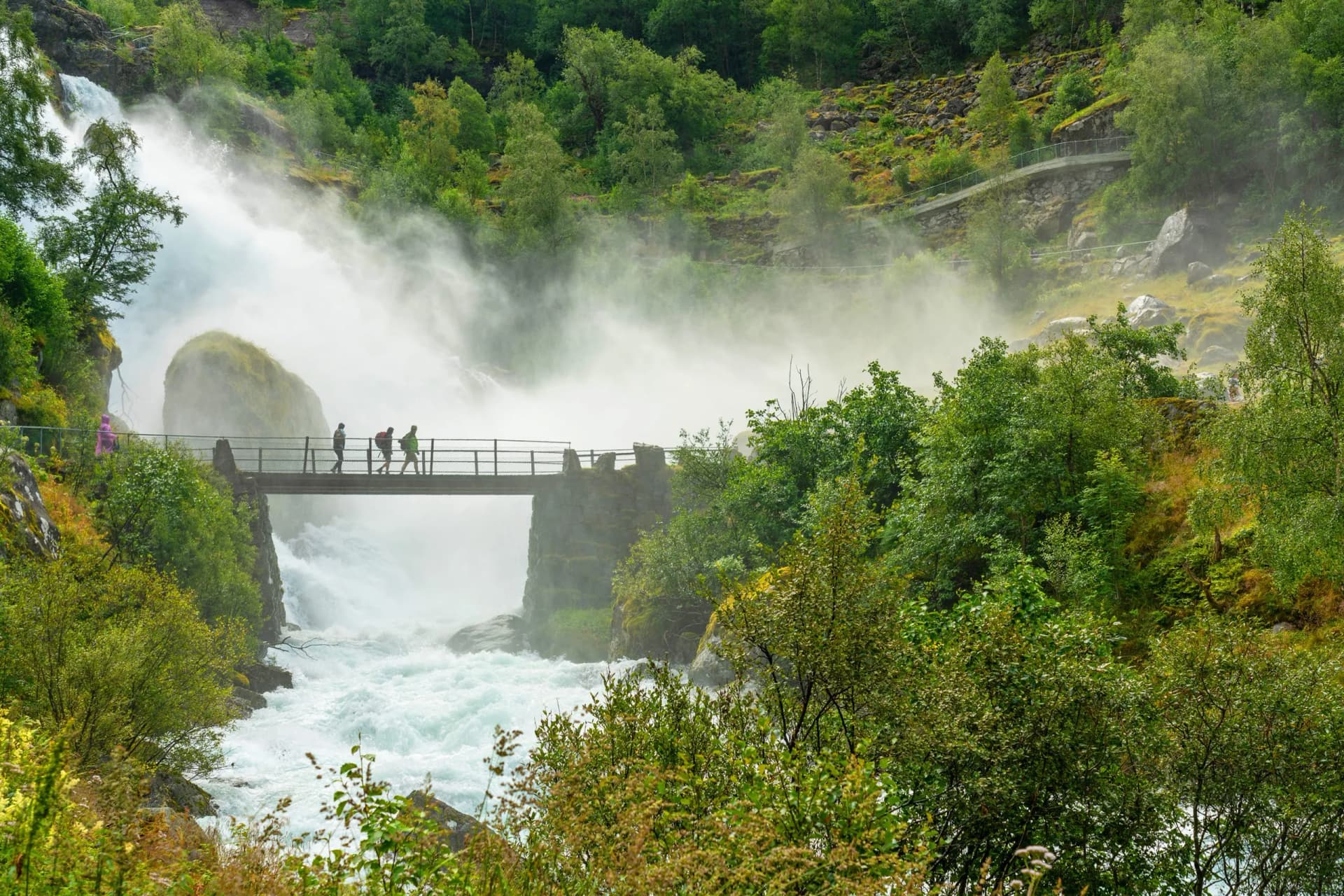 Jostedalsbreen national park, bridge in waterfall, Norway.