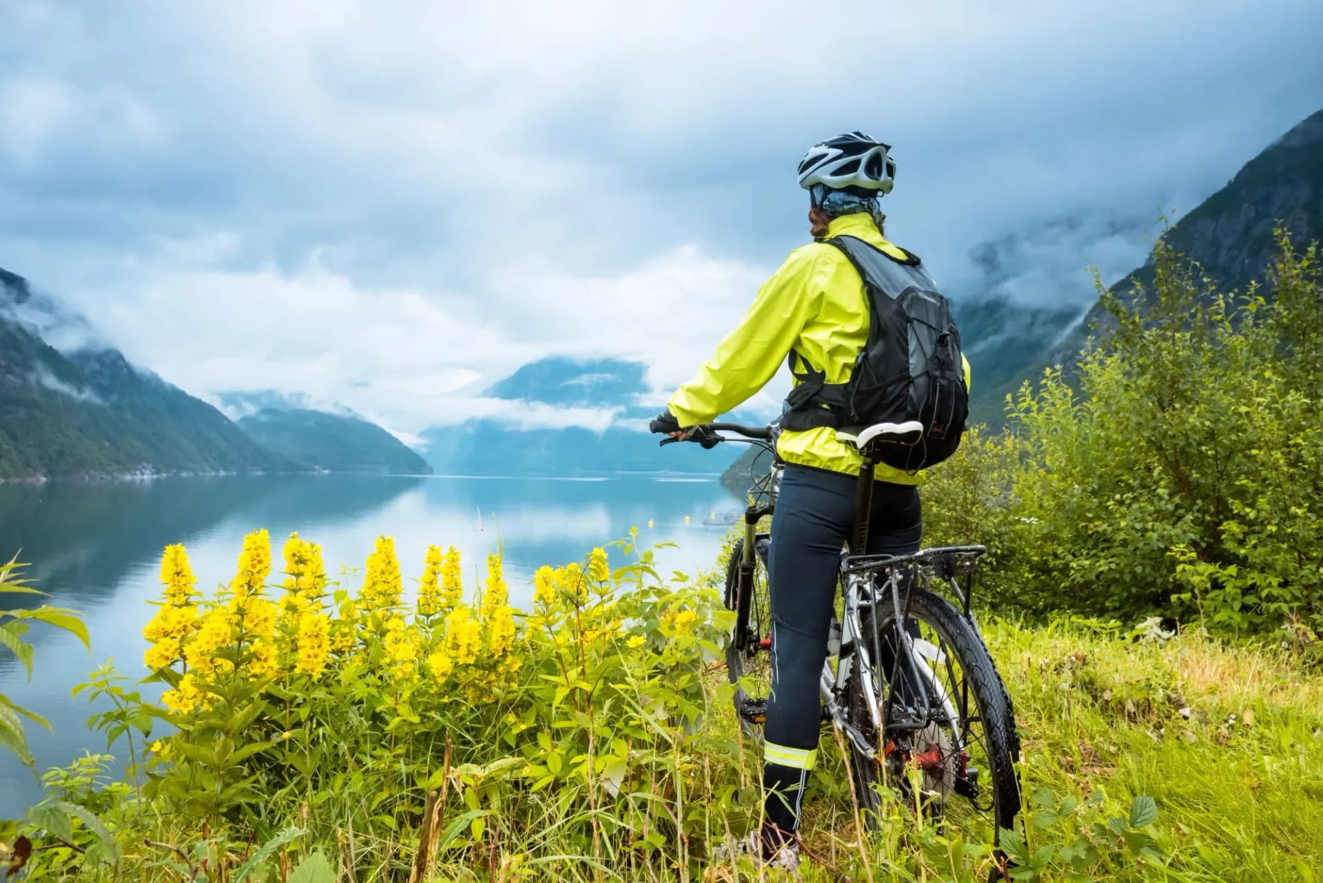 cyclist near fjord