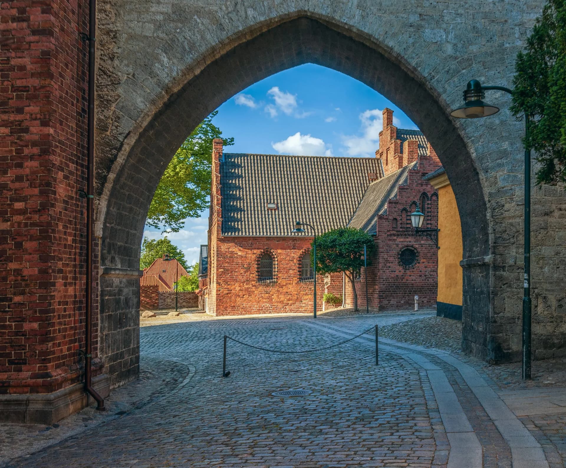 The Absalon Arch built between bishop's palace and Gothic Roskilde Cathedral.Roskilde.Denmark