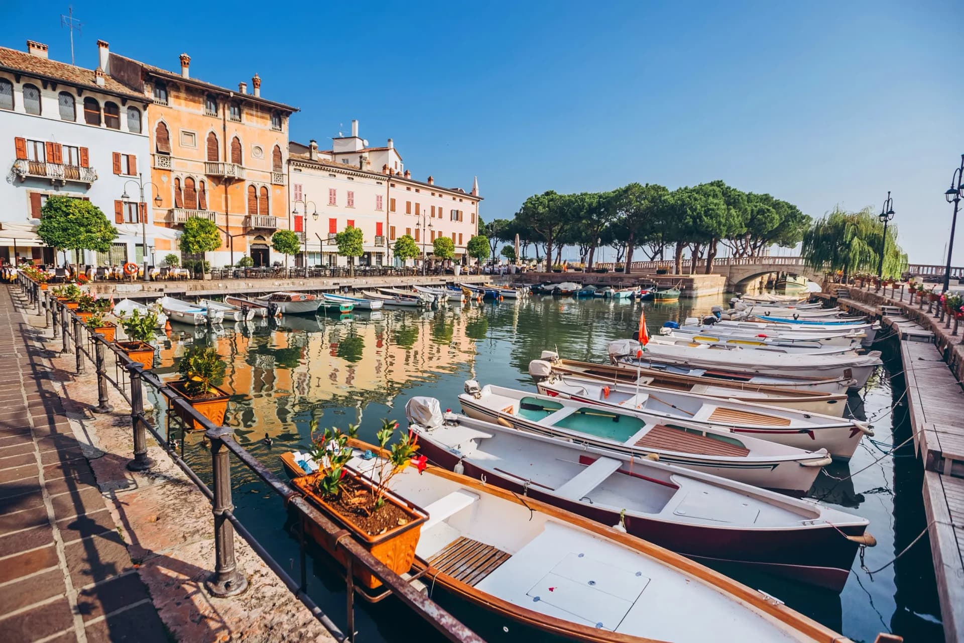 old harbour full of boats in Desenzano del Garda. Brescia, Lombardy, Italy. City Centre of Desenzano del Garda. marina on Lake Garda.