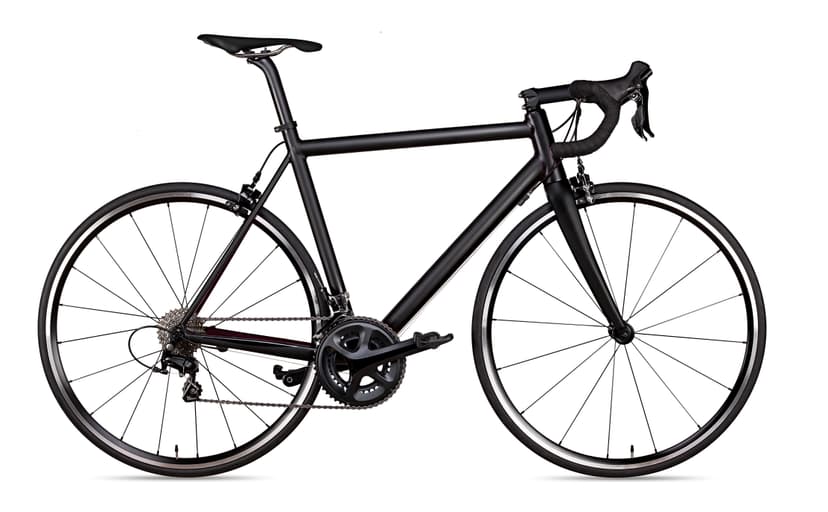 Black road bike with drop handlebars isolated on a white background