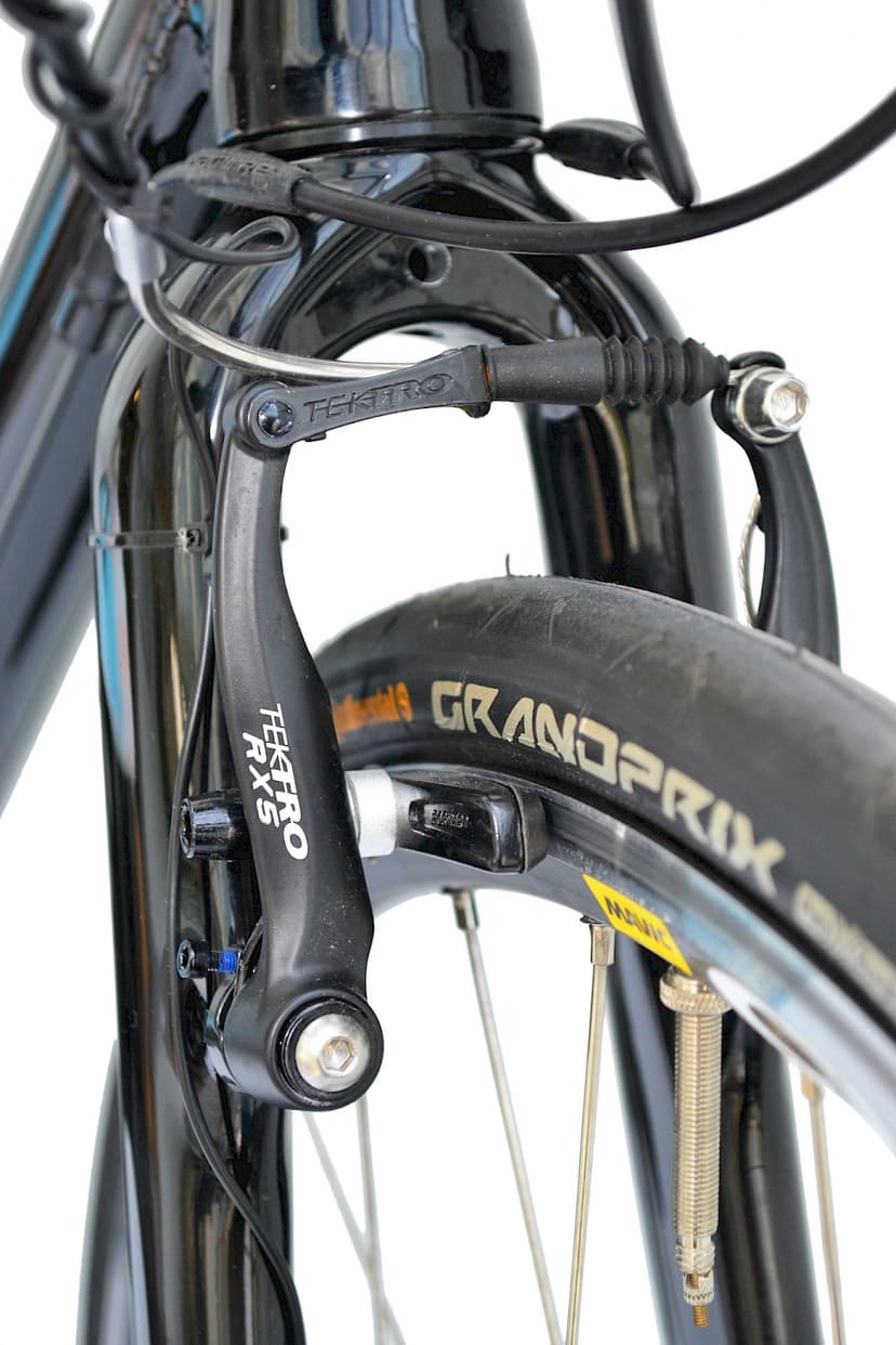 Close-up of Tektro RX5 road bike caliper brake and Continental Grand Prix tire.