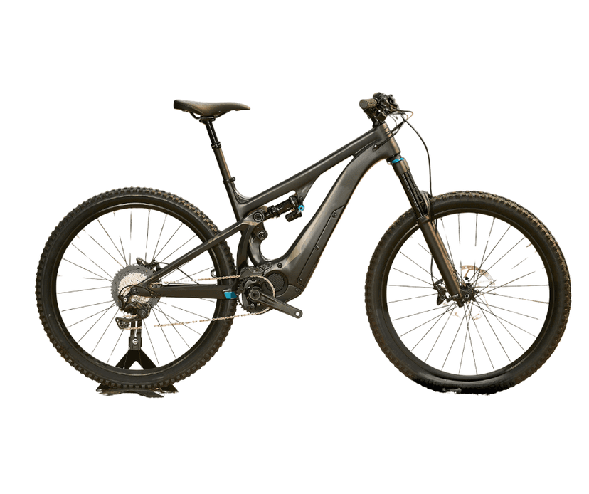 Black full-suspension electric mountain bike displayed on a stand against a white background