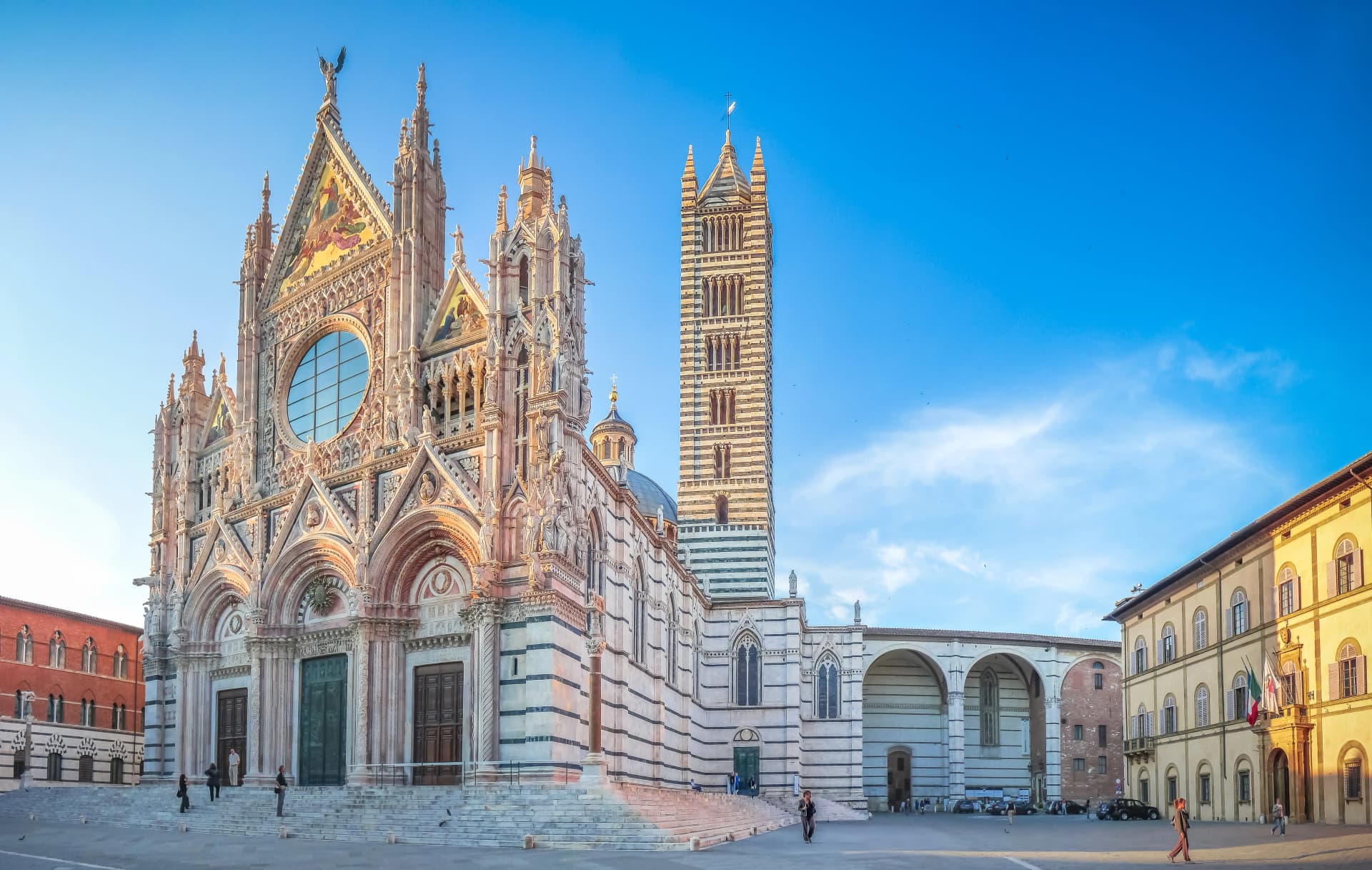Famous Piazza del Duomo with historic Siena Cathedral