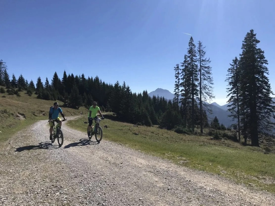 Mountain biking above Trzic on a sunny day with clear blue sky.