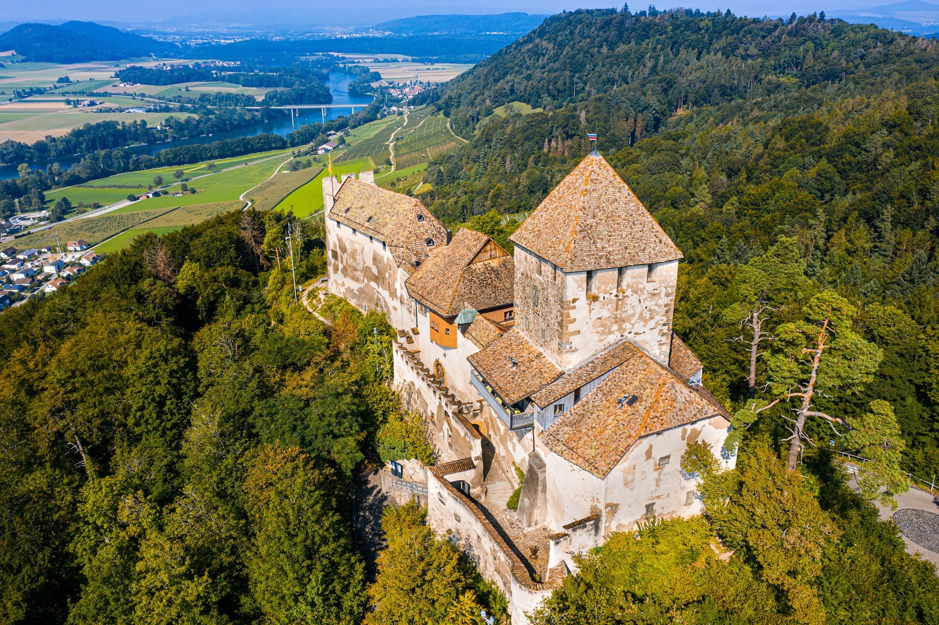 Schloss Hohenklingen afternoon view overlooking the Rhine river valley and surrounding hills.