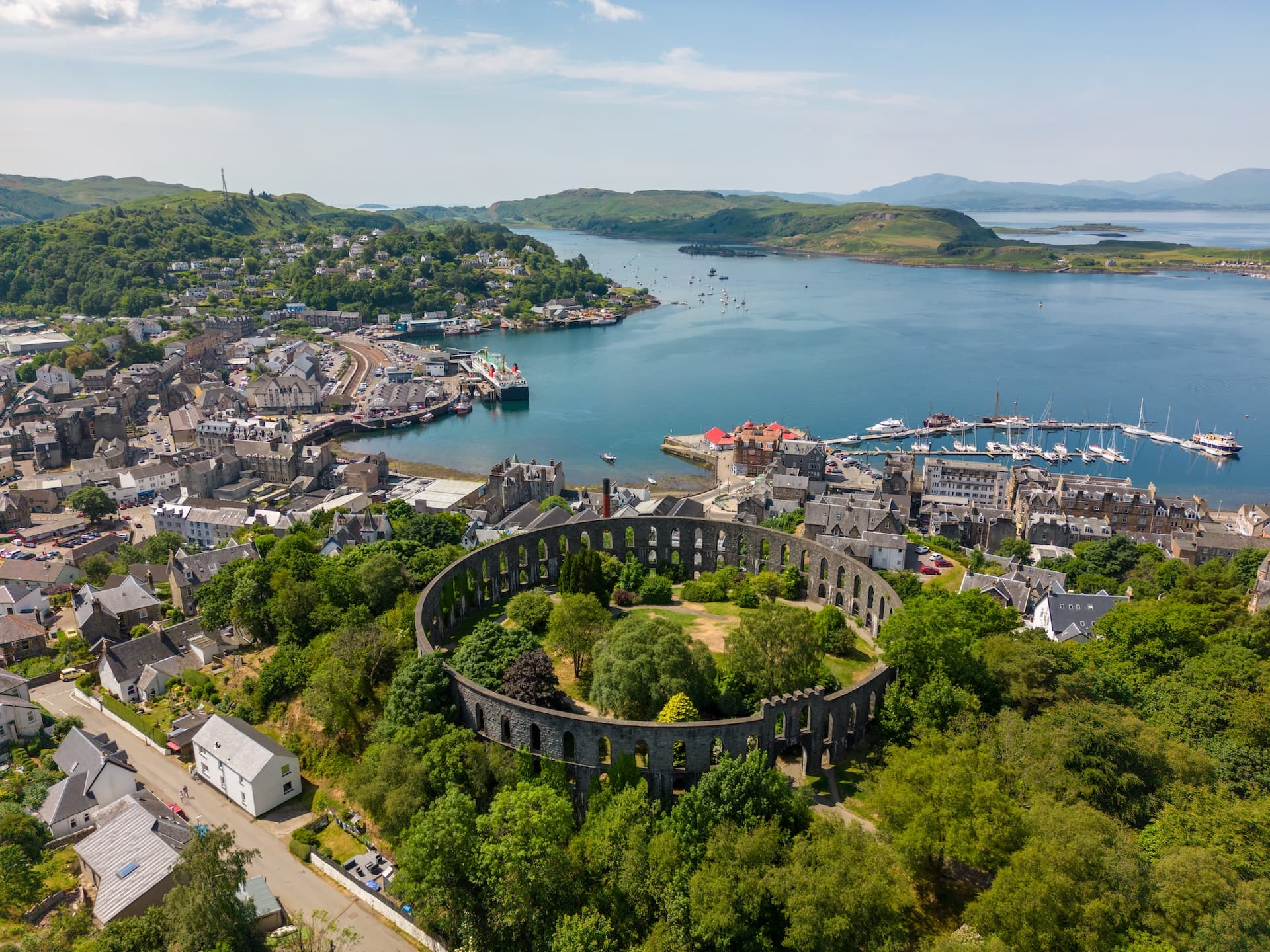 McCaig's Tower ruins overlooking the harbor and sea in Oban, Scotland.