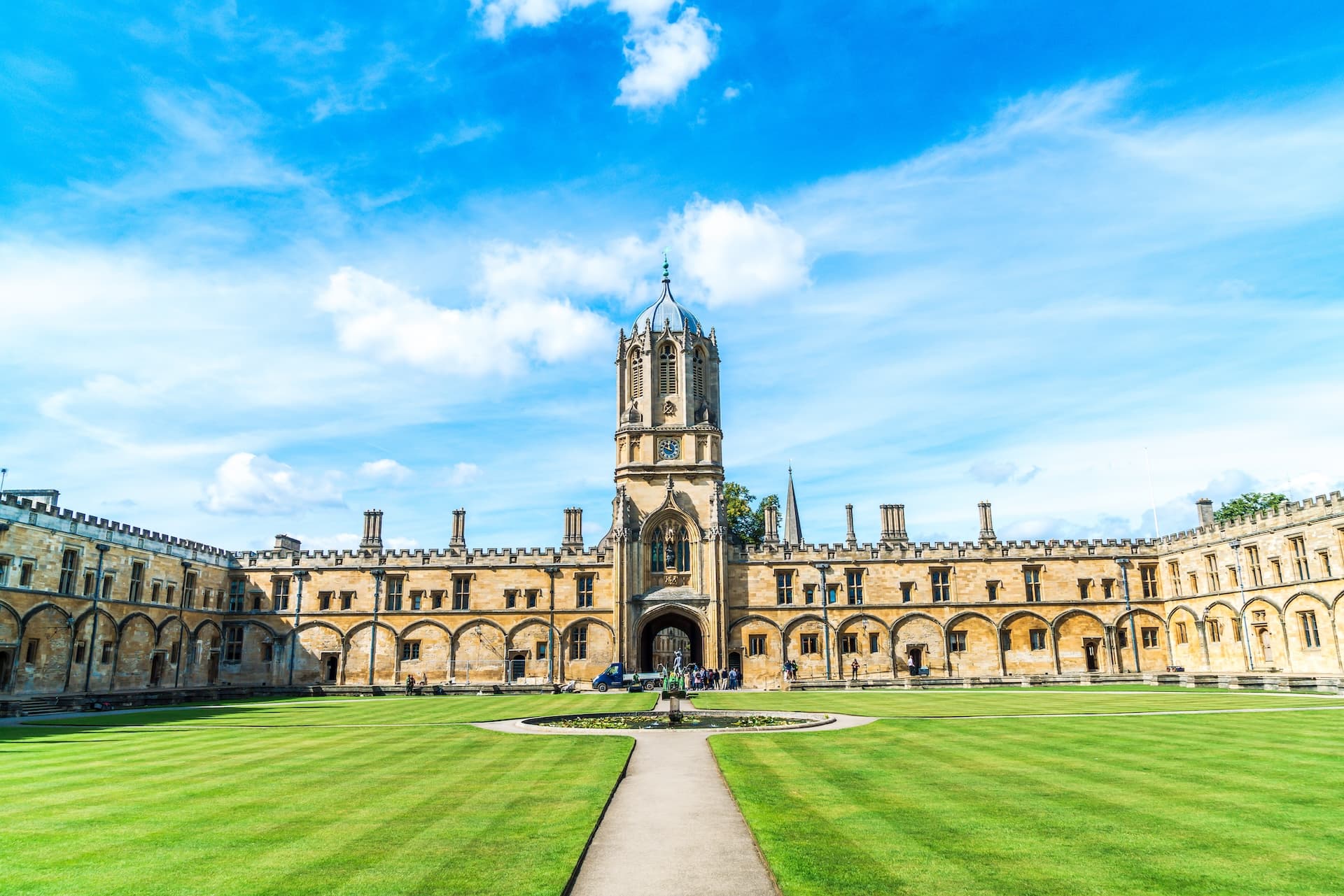 Christ Church college quad with Tom Tower under a bright blue sky, Oxford University.