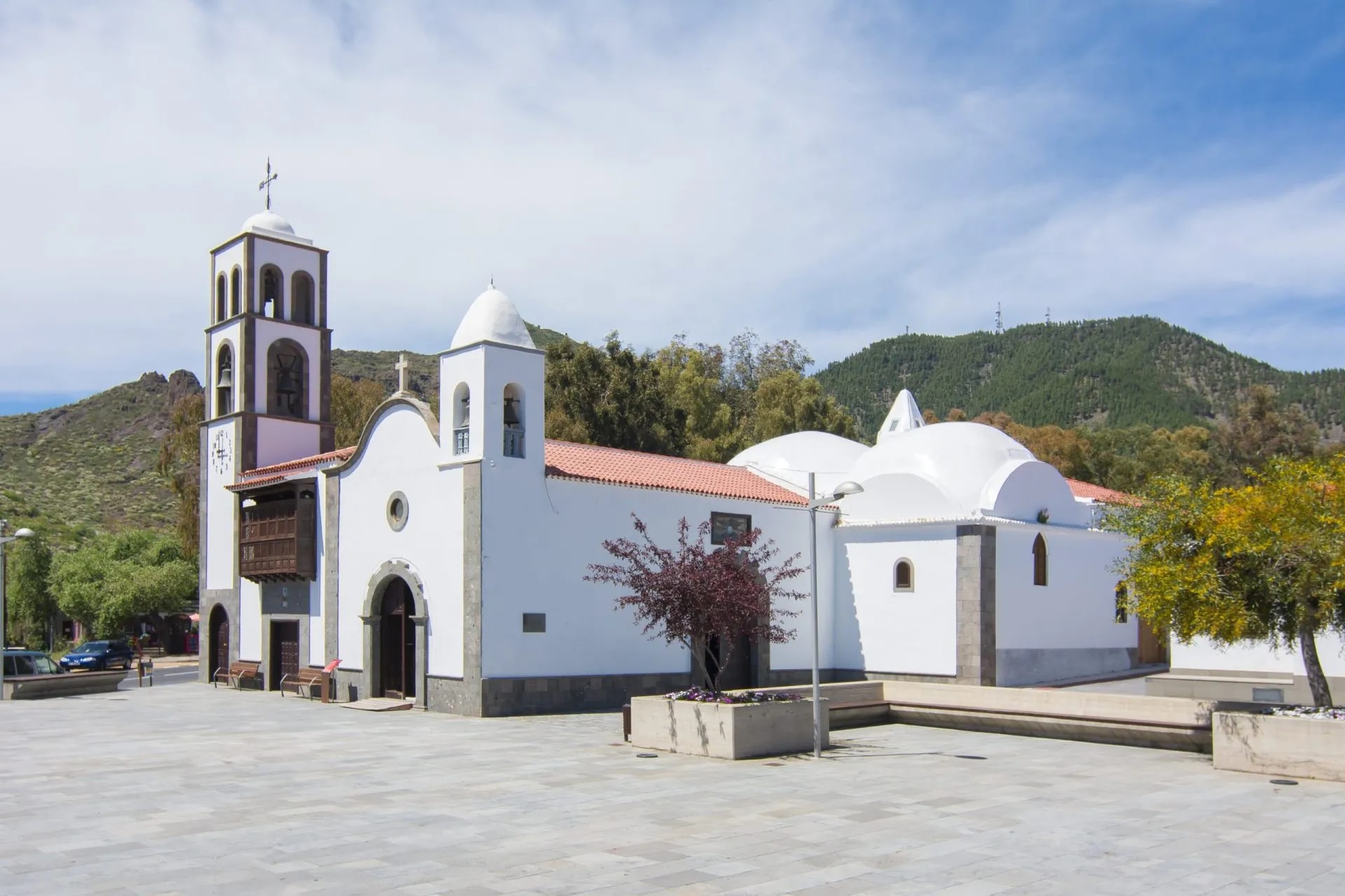 Iglesia Church de San Fernando Rey in Santiago del Teide, Tenerife, with white walls and bell tower.