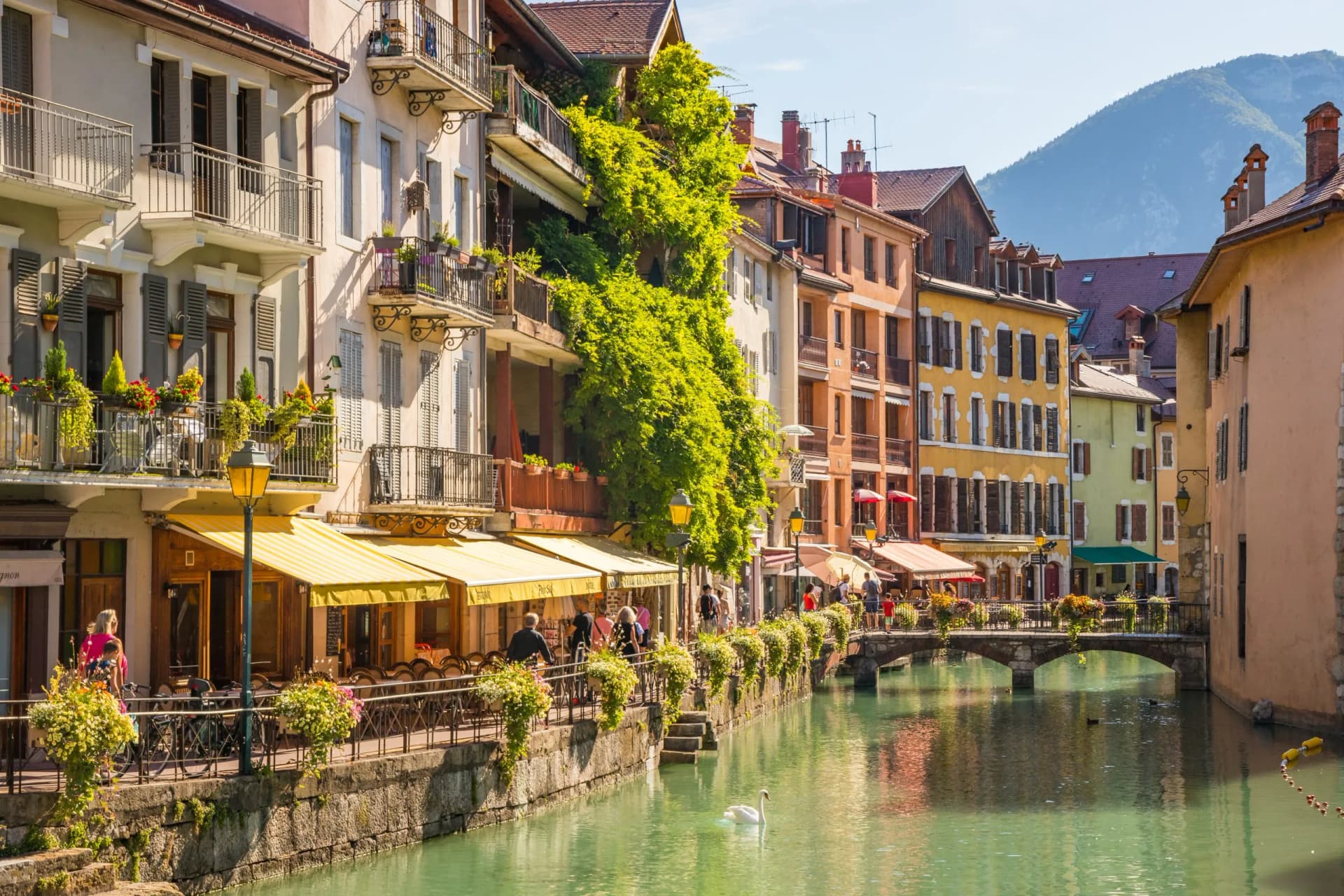 Old city of Annecy with colorful buildings, cafes, and the Thiou River, Haute-Savoie, France.