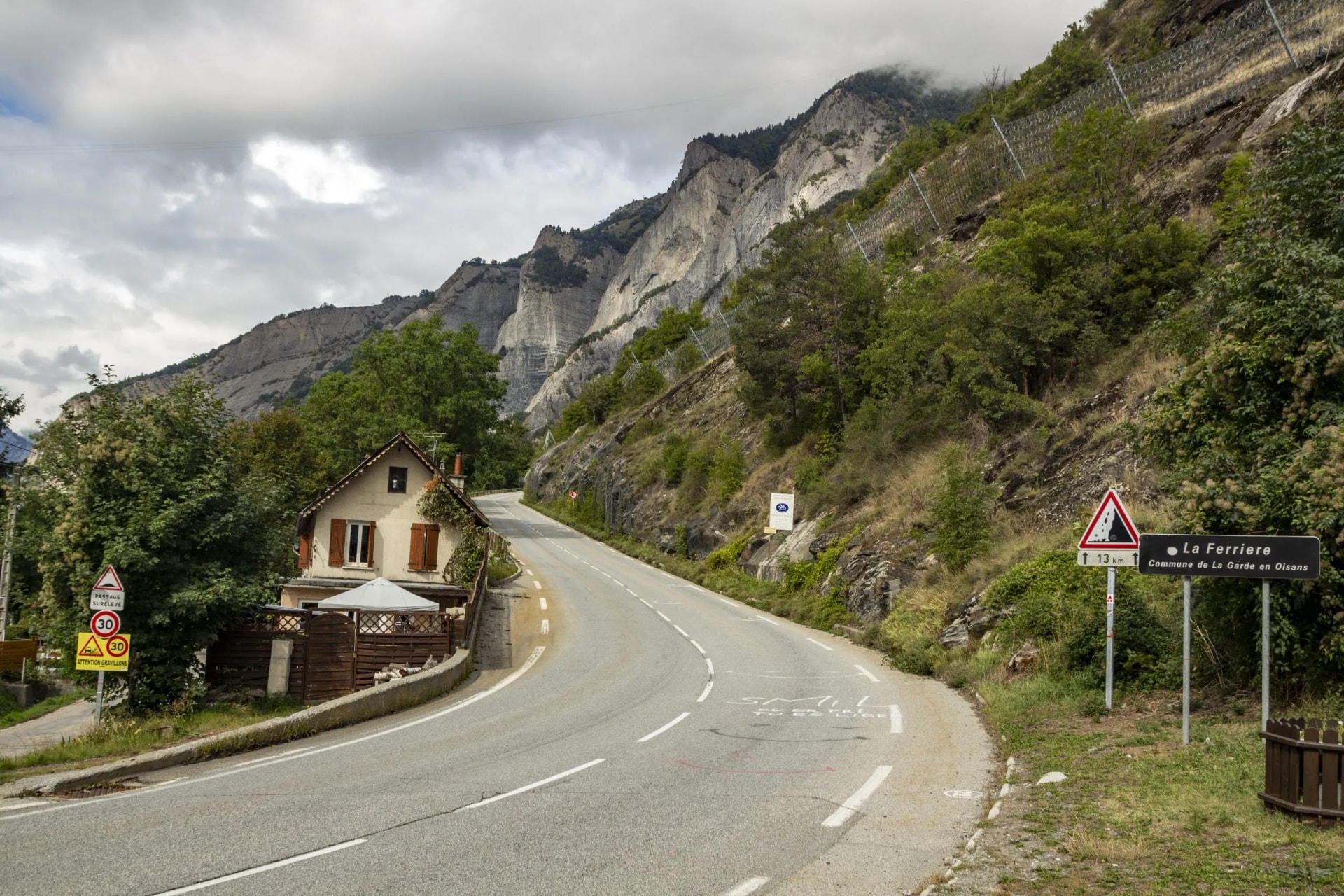 Winding mountain road ascent near La Ferriere, Commune de La Garde en Oisans, France.