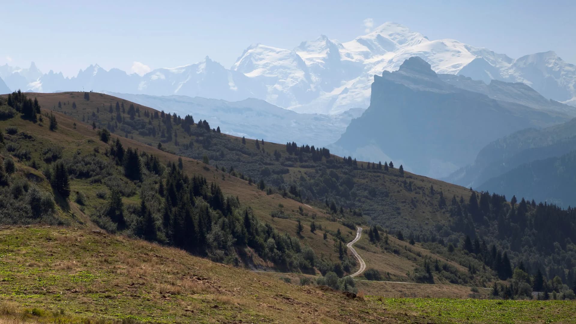 Summertime view of snow-capped Mont Blanc from Col de Joux in the French Alps.