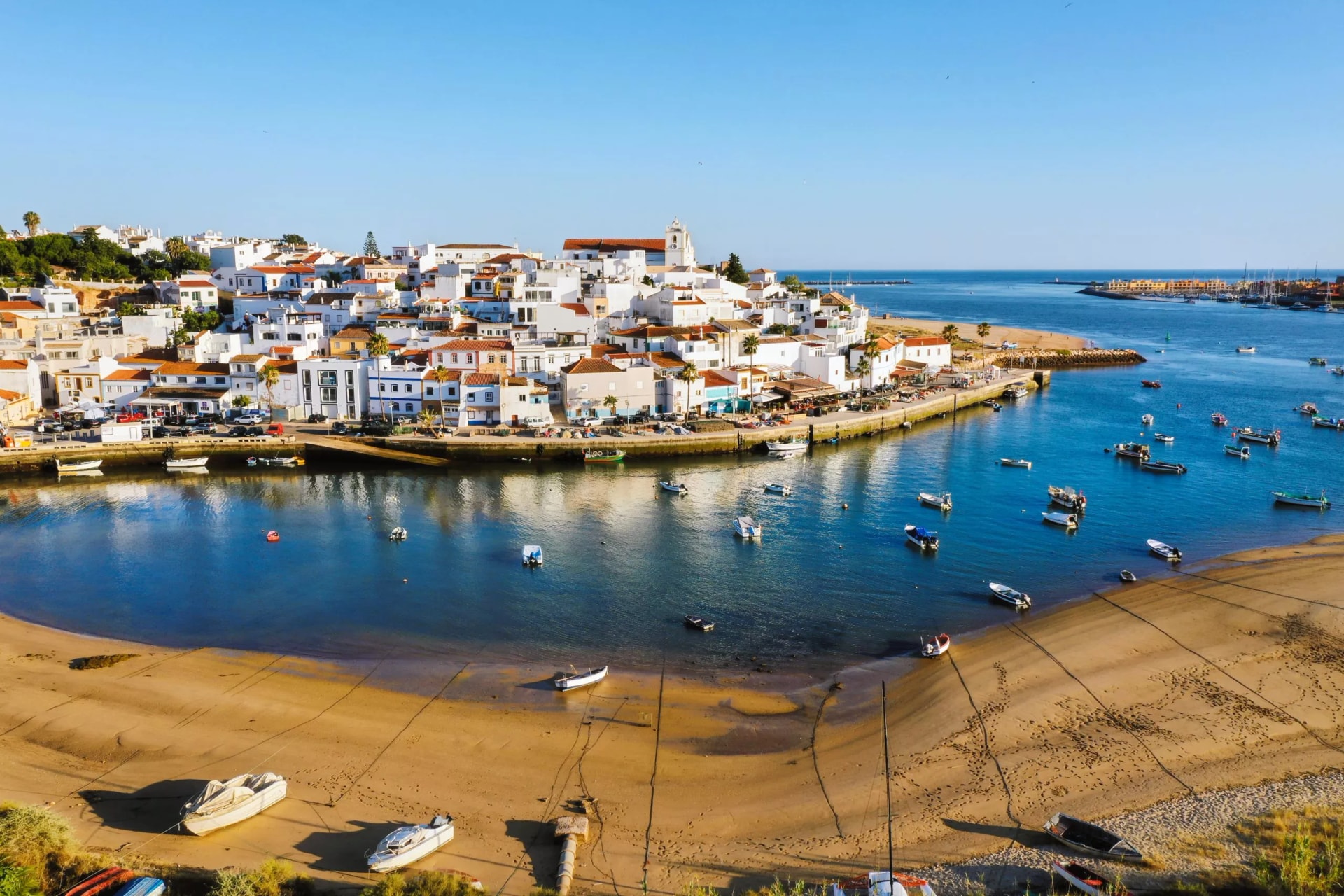Aerial cityscape of Ferragudo by Arade River, Algarve, Portugal
