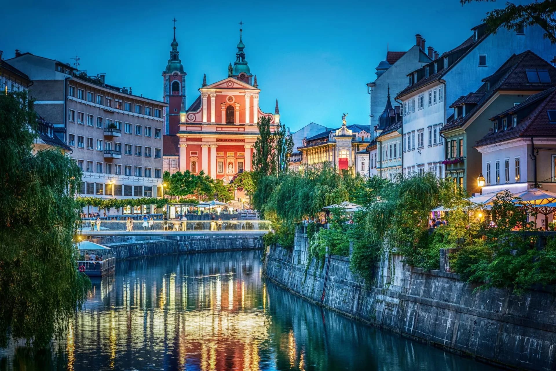 evening view of the bridge and ljubljanica river in the city center ljubljana capital of slovenia stockpack adobe stock scaled