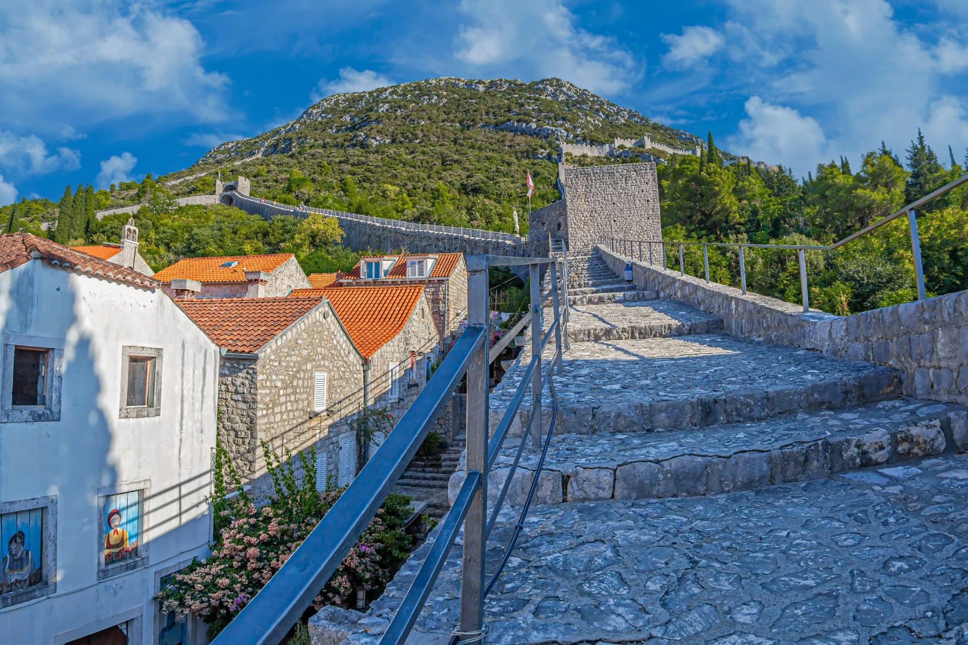 Aerial view with the roofs of old houses from the small town of Ston and medieval fortifications. Dubrovnik area, Croatia