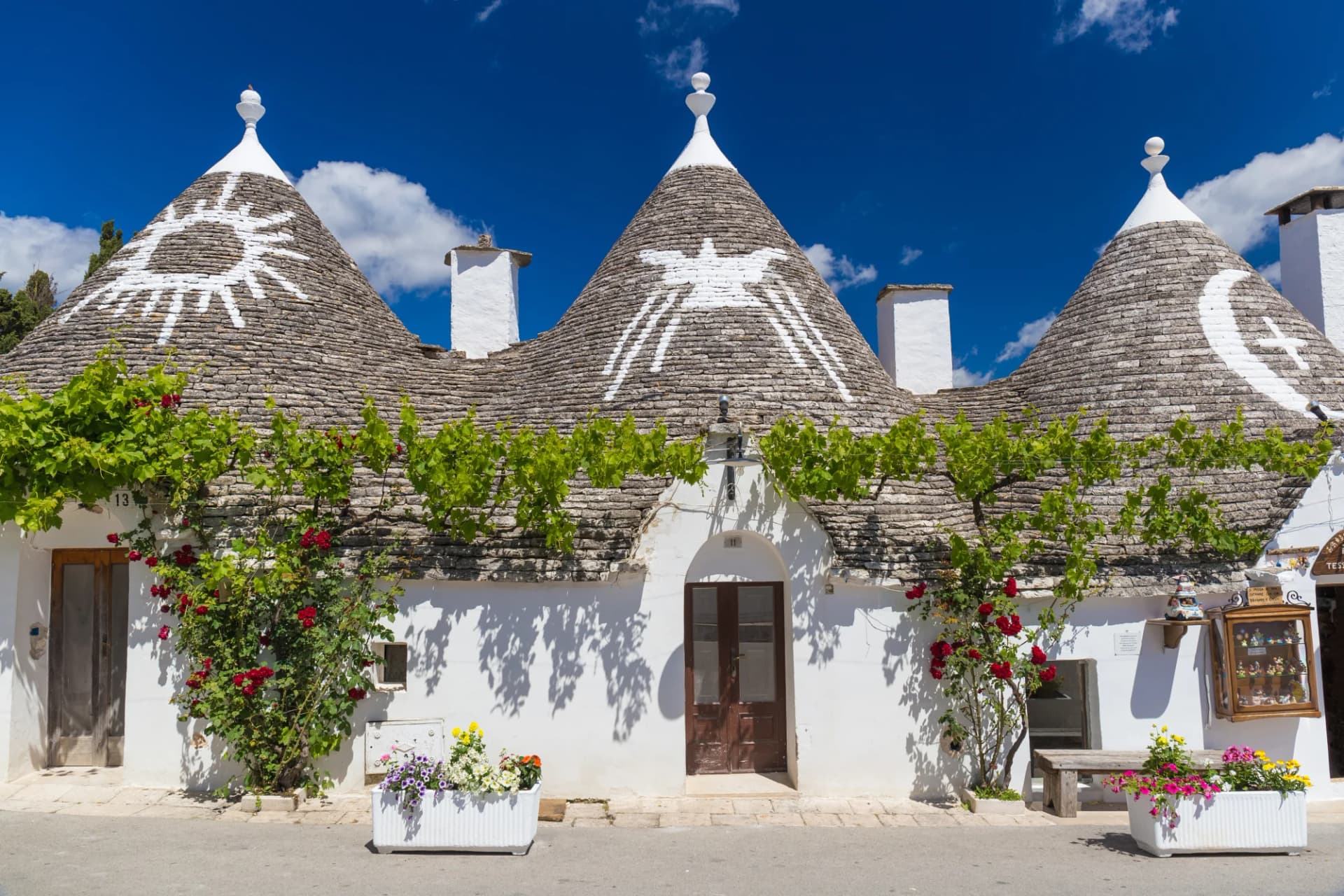 Trulli houses with conical stone roofs and white walls in Alberobello, Apulia, Southern Italy.