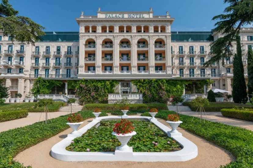 Palace Hotel Portoroz facade with formal gardens and lily pond in summer