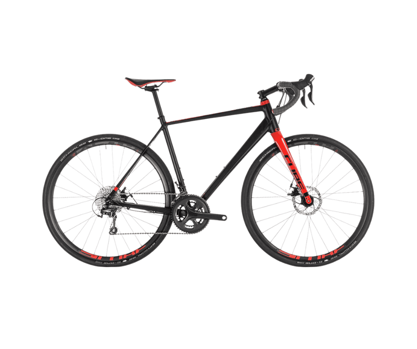 Black and red Cube road bike with Schwalbe tires isolated on white background