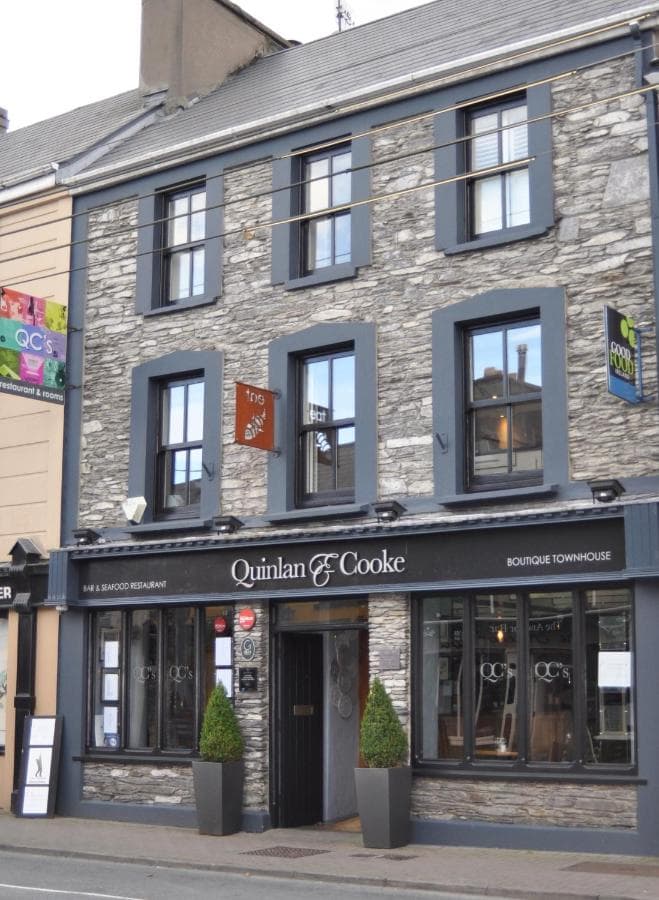 Quinlan & Cooke Boutique Townhouse bar and seafood restaurant with stone facade on street