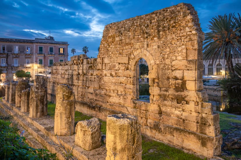 Evening View of the Ruins of the Ancient Greek Temple of Apollo on Ortygia Island in Syracuse, Sicily, Italy - UNESCO World Heritage