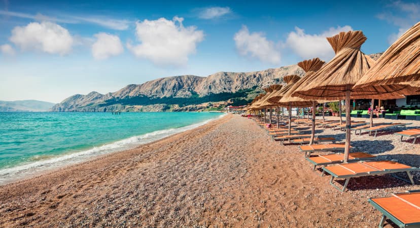 Sunny morning view of Bashka Beach in Baska town. Amazing summer seascape of Adriatic sea, Krk island, Kvarner bay archipelago, Croatia, Europe. Beautiful world of Mediterranean countries.