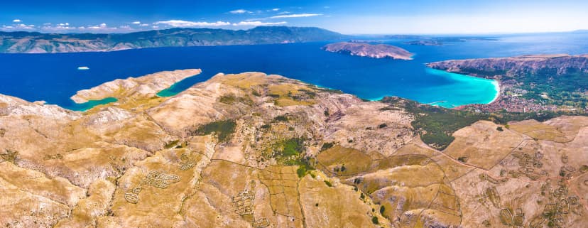 Moon Plateau stone desert heights aerial panoramic view, view of Baska, Senj, Vela and Mala Luka on Krk island