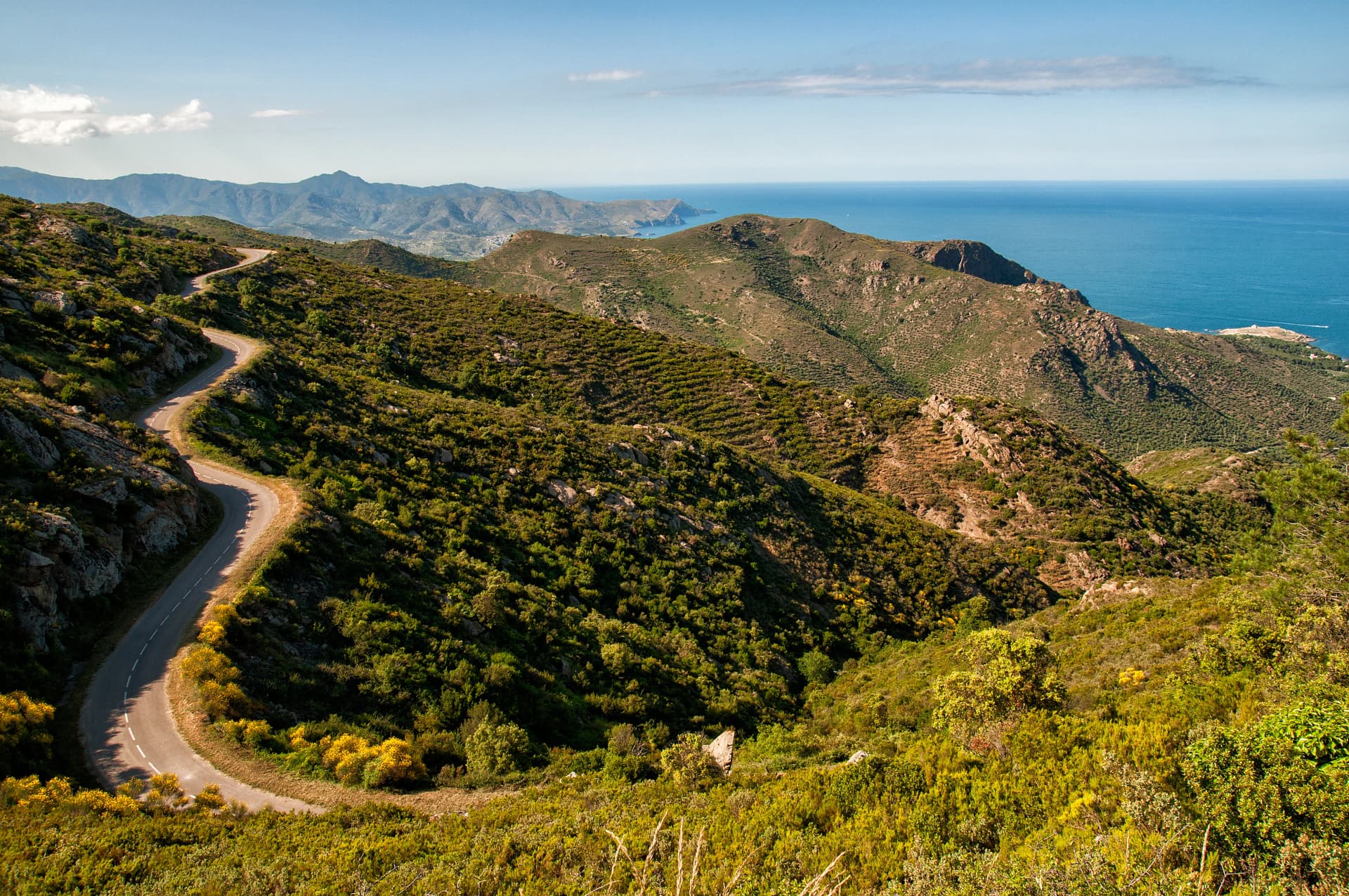 Winding road through mountains in the coast of Cap de Creus, Girona, Spain
