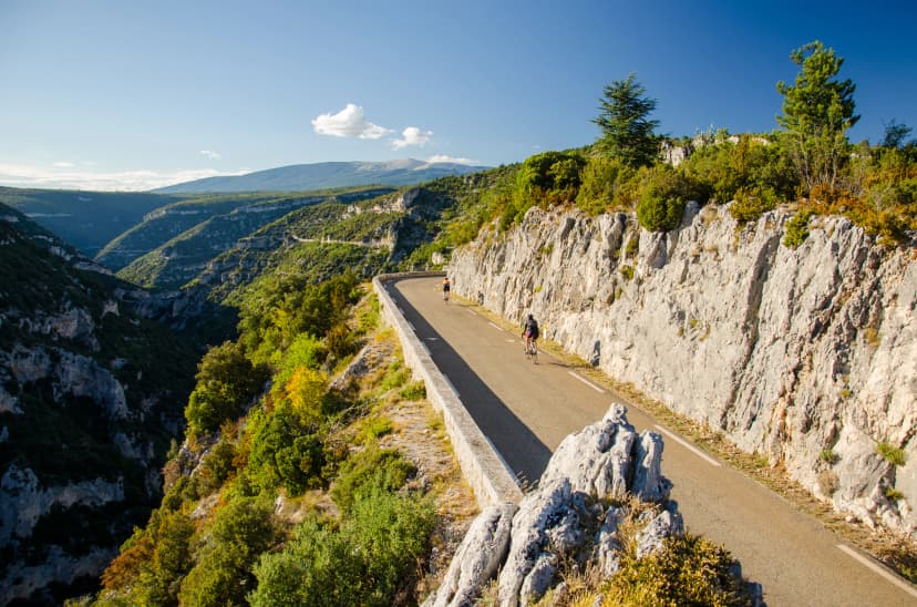 Cyclists on the Gorges de la Nesque road in Vaucluse Mountains region