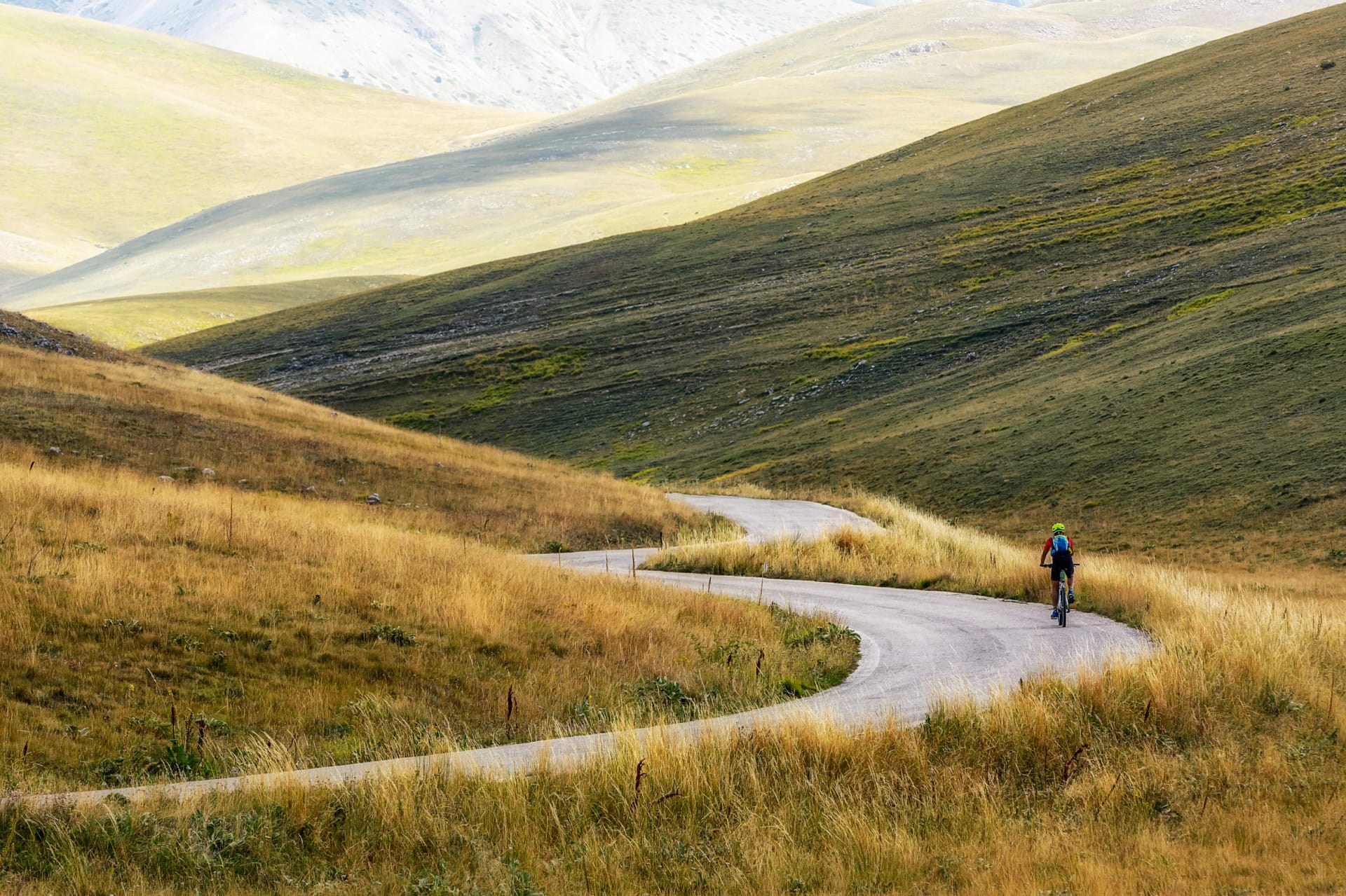 A Isolated Cyclist uphill on a Mountain Road of Campo Imperatore - Abruzzo -Italy