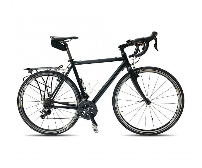 Black gravel bike with drop handlebars, rear rack, and saddle bag on a white background.