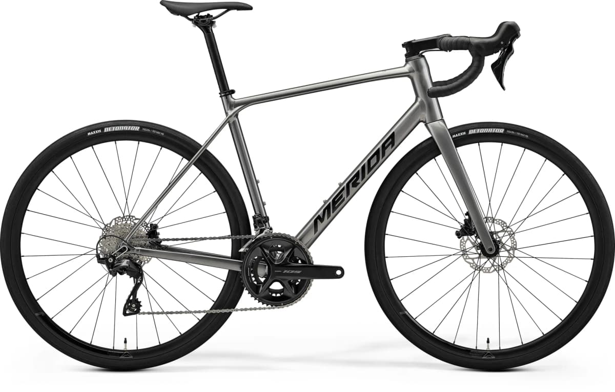 Merida road bike with a grey frame and black components on a white background.