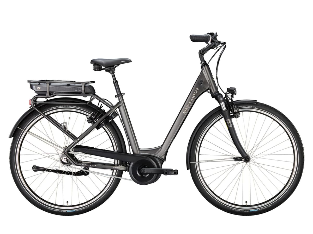 Grey Brennabor electric city bike with rear rack and Bosch motor against a white background.